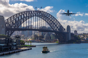Plane Flying Over Sydney Harbour Sydney Nsw Australia.